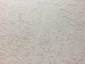 Stucco textured in Heavy Swirl Worm style.